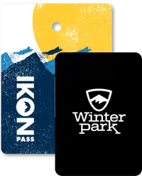 Collage of season passes, Ikon Pass creative in the back, and a Winter Park pass in front.