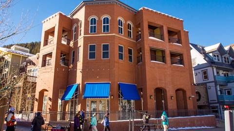 an exterior view of the brick townhome layouts at parry peak lofts vacation rentals in winter park colorado