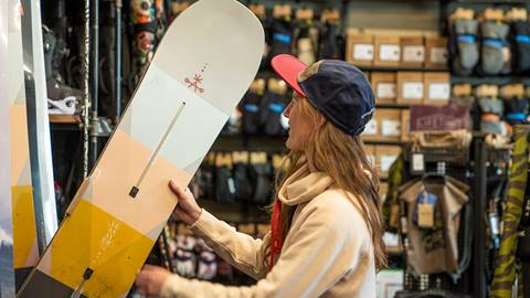Man and women shopping at Burton Snowboards retail shop