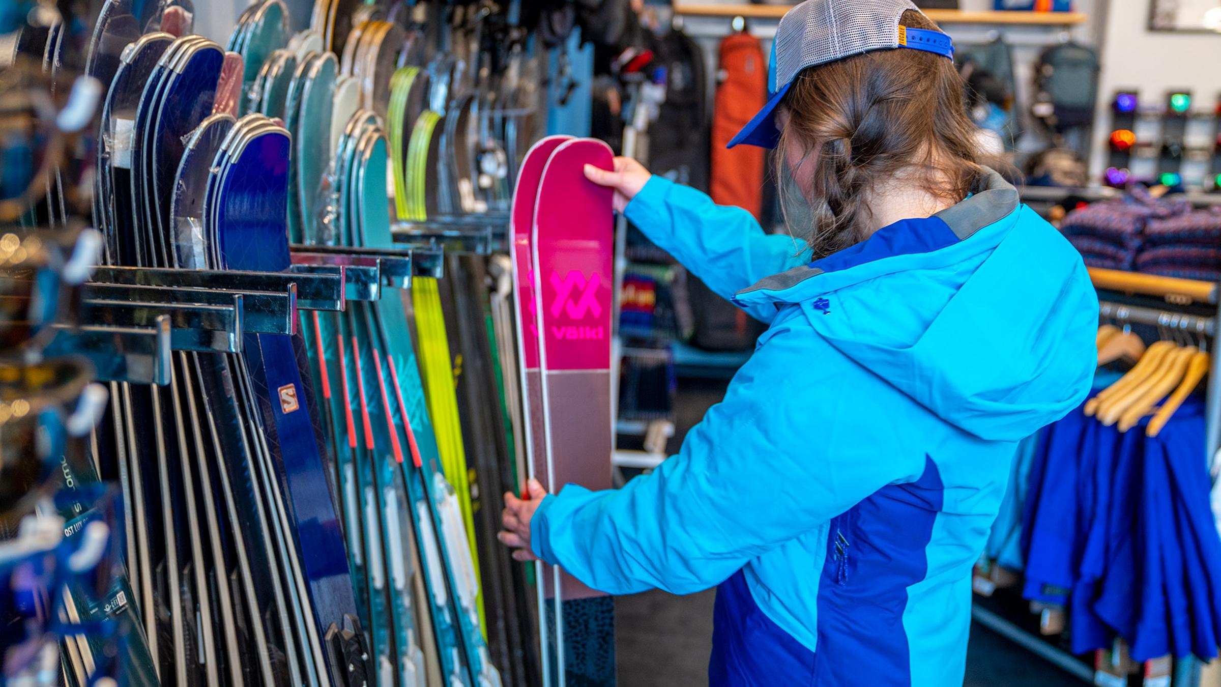 Women being fitted for rental skis in Winter Park Village