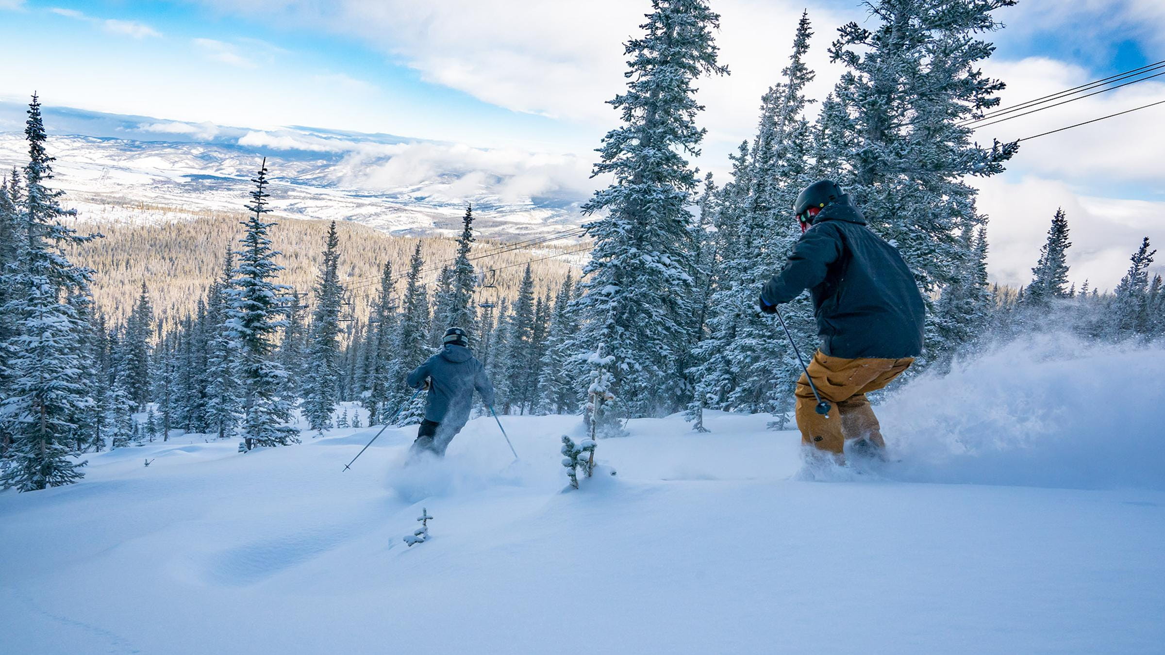 Two young adults skiing Eagle Wind on Winter Park Resort