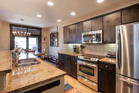 a modern upscale kitchen layout inside the parry peak lofts vacation rentals in winter park colorado