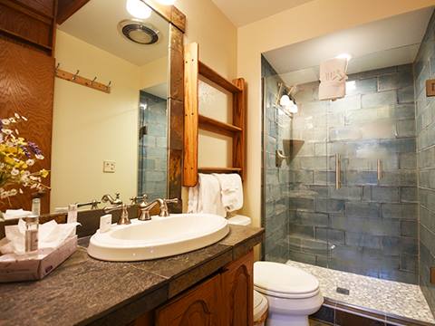 A bathroom at the 61 Jabberwocky vacation rental at Winter Park Resort