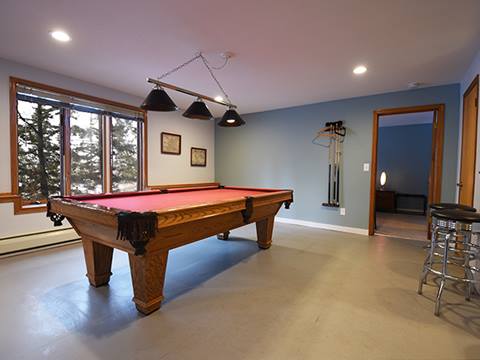 A pool table in  the 61 Jabberwocky vacation rental at Winter Park Resort 
