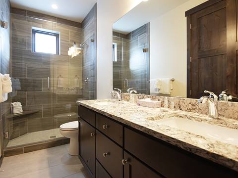 A bathroom with his and hers sinks in an Arrow Townhome vacation rental at Winter Park Resort