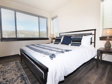 A master bedroom in an Arrow Townhome vacation rental at Winter Park Resort 