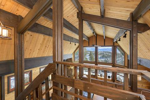 Wooden beams taken from a loft display a hexagonal ceiling. 
