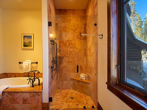 Tiled shower and bath on the left. 