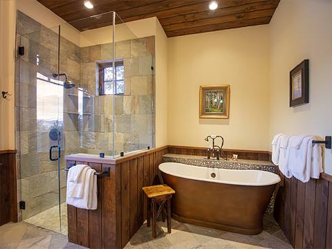 ensuite bathroom with wash basin and stone shower. 