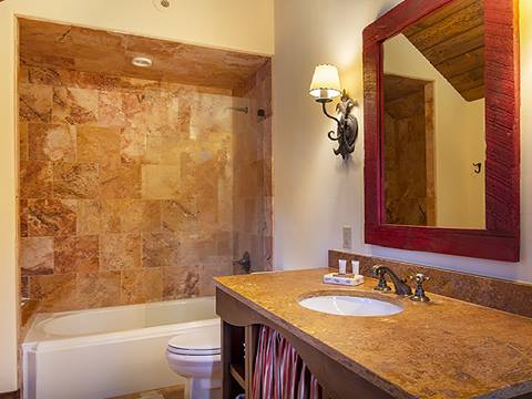 Tile bathroom shower with wooden mirror. 