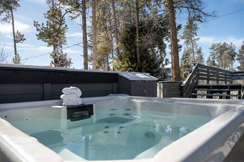 View of hot tub from outside on home's deck. 