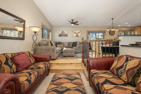 Image of two living rooms, one with bright-colored furniture and one with sectional couch. 