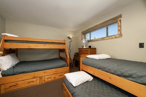 Twin bedroom with bunk bed and twin trundle. 