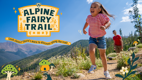 young girl running down a mountain path with an expansive view of alpine valleys and ridges at winter park resort in colorado