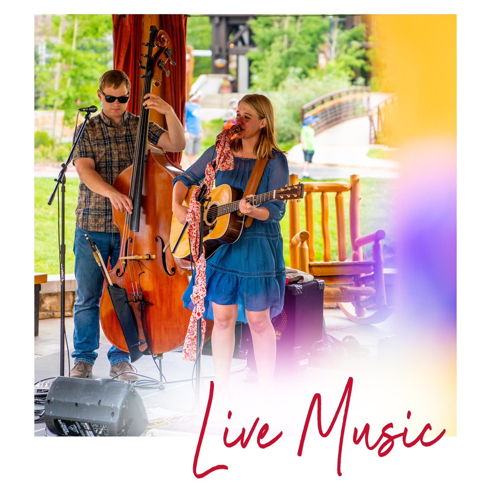 Two musicians performing in the village gazebo at Village Uncorked. Live Music 