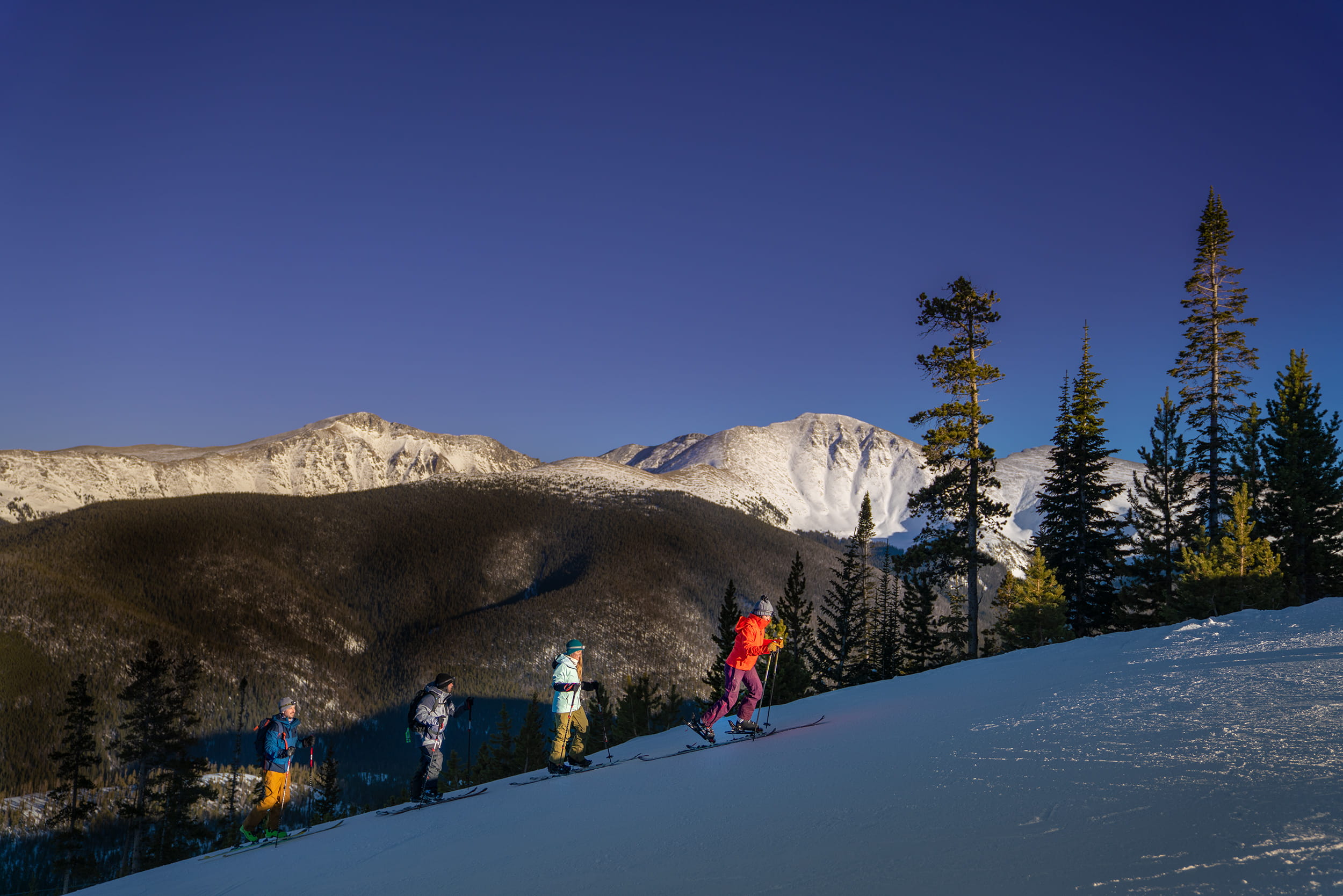 A group of 4 people touring at winter park