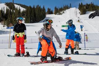 Children snowboarding lessons at Winter Park Ski Resort Colorado