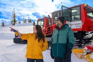 Man and women on a Snowcat tour at Winter Park Resort