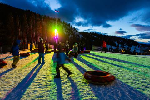 snow tubing at top of hill during night snow tubing at winter park resort