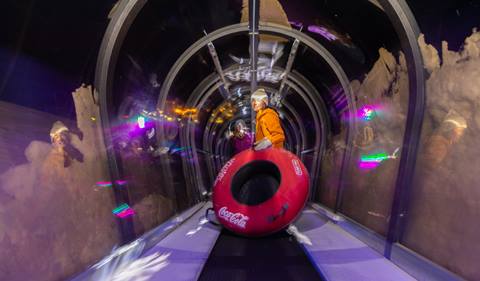 two girls in snow tubing tunnel at night snow tubing at winter park resort