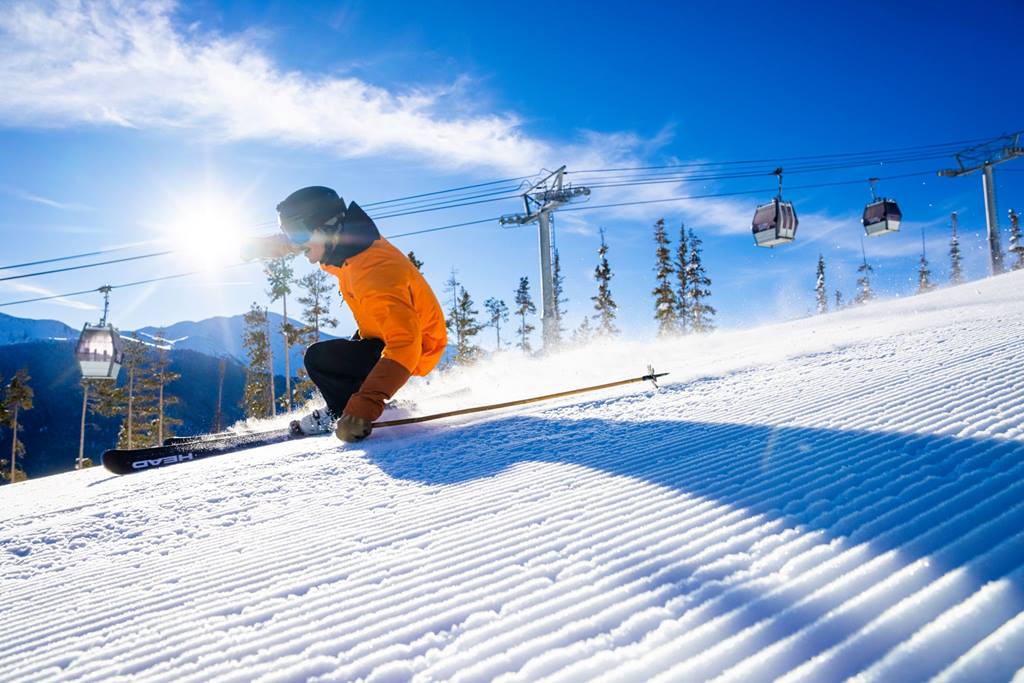 Skier on groomed run at Winter Park Resort Colorado