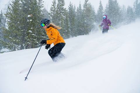 Skier in deep snow at Winter Park Ski Resort Colorado