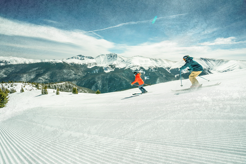 Skiers enjoying winter conditions at Winter Park Resort in Colorado