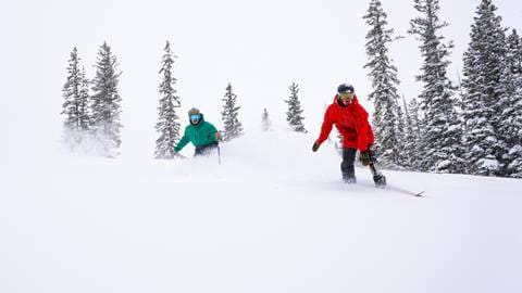 A skier and Paralympic Snowboarder get first track in Parssen Bowl 