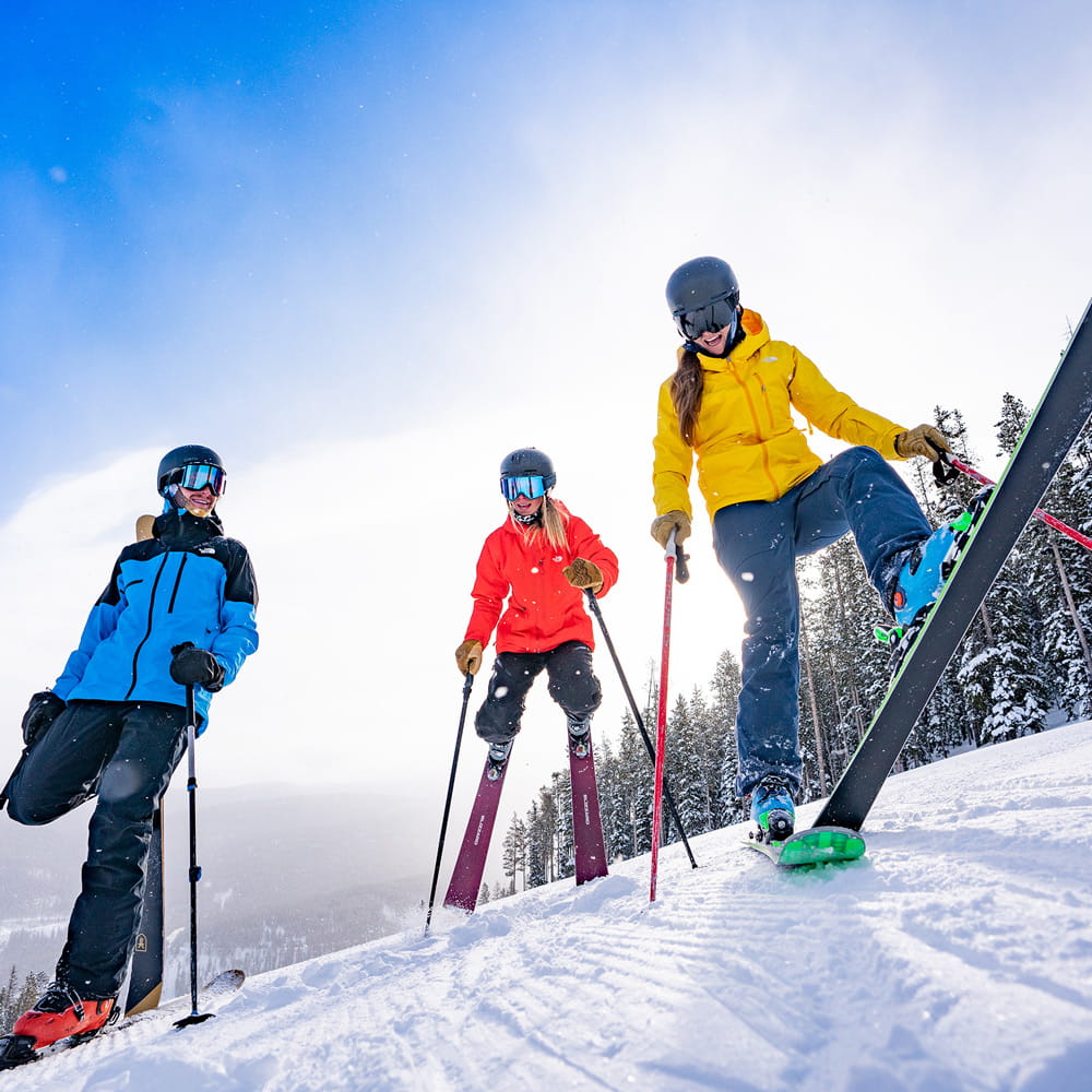 3 Skiers at winter park resort